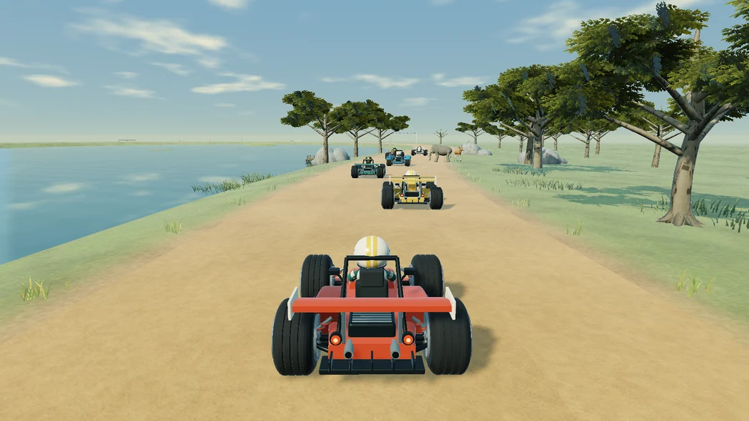Karts racing along a broad river with woodland beside the track